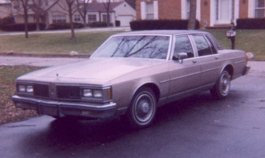 1985 Oldsmobile Delta 88 Royale Brougham It was maroon with a maroon vynil